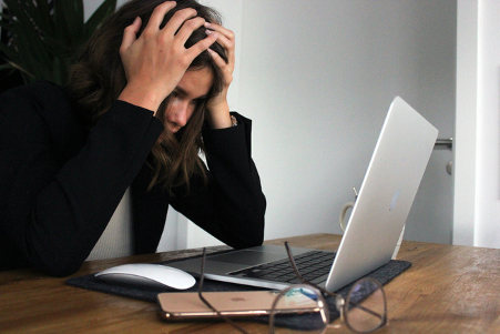 stressed woman at workdesk