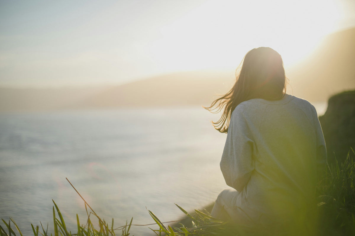 woman soul searching by the sea