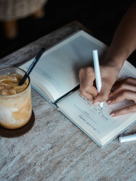 Woman writing in journal