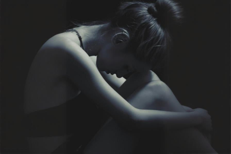 woman struggling with emotional wounds